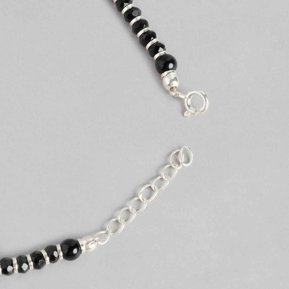 Elegant Enigma Rhodium Plated Black Bead Anklet in 925 Sterling Silver