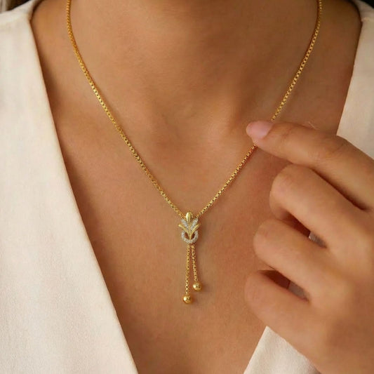 Woman wearing a gold plated 925 Sterling Silver drop pendant necklace. Elegant jewellery for women – Zavya